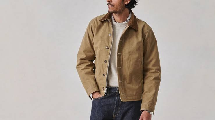 Model wearing work jacket outfits with canvas jacket, tee, and boots